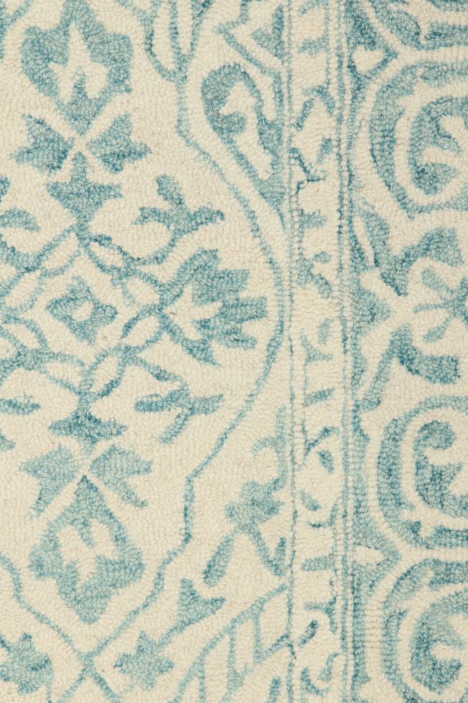 BLUE AND IVORY PERSIAN HAND TUFTED CARPET