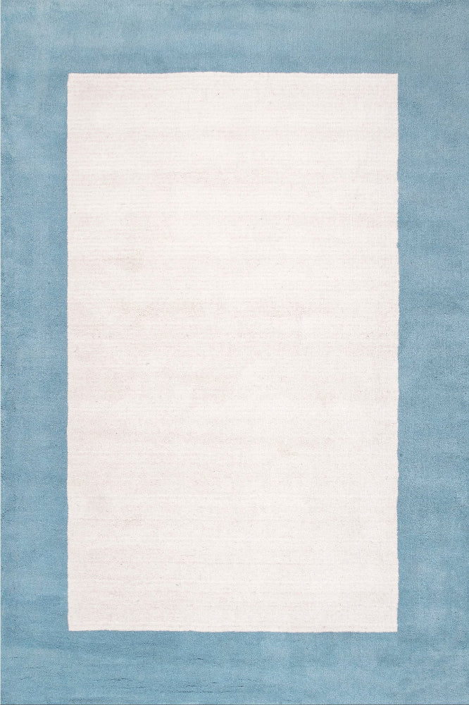 IVORY & BLUE BORDERED HAND TUFTED RUG
