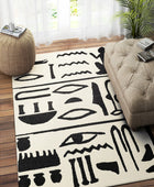 BLACK AND IVORY TRIBAL HAND TUFTED CARPET