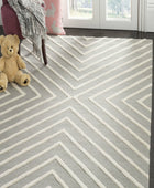 GREY AND IVORY GEOMETRIC HAND TUFTED CARPET