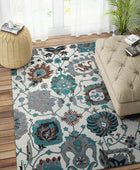 IVORY AND TEAL SUZANI HAND TUFTED CARPET