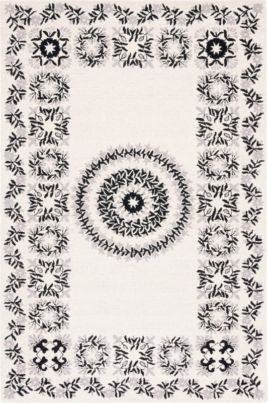 IVORY AND BLACK FLORAL HAND TUFTED CARPET