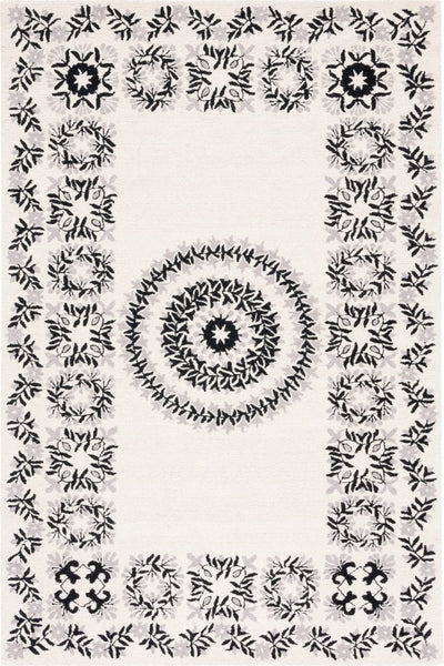 IVORY AND BLACK FLORAL HAND TUFTED CARPET